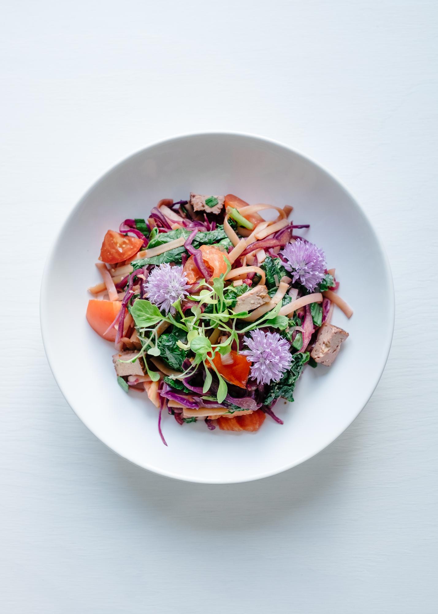 Plated seasonal salad with herbs